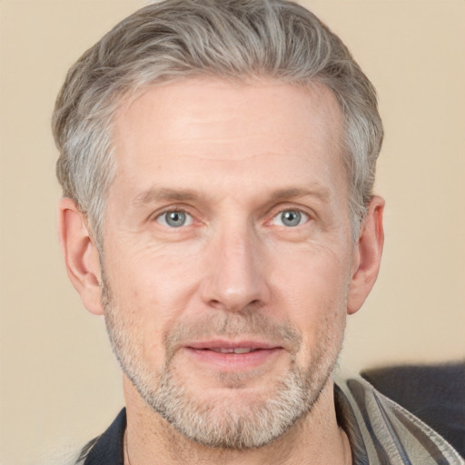 Neutral white middle-aged male with short  gray hair and grey eyes