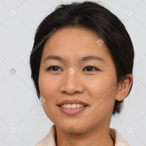 Joyful asian young-adult female with medium  brown hair and brown eyes