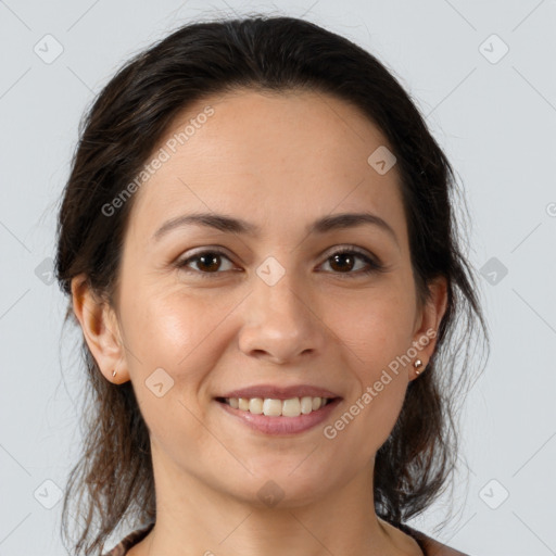 Joyful white young-adult female with medium  brown hair and brown eyes