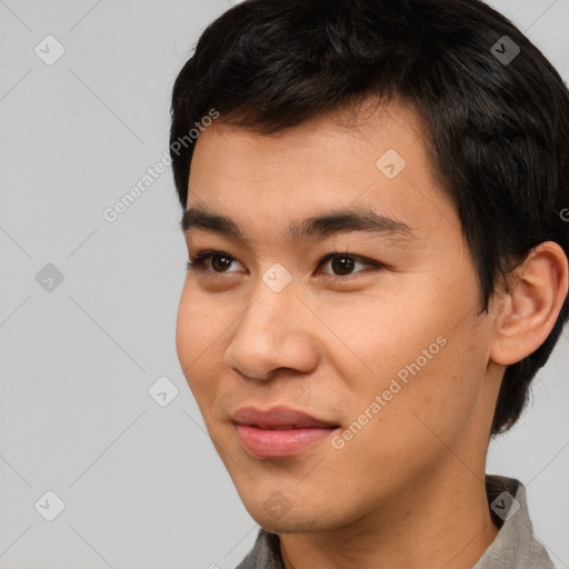 Joyful asian young-adult male with short  black hair and brown eyes