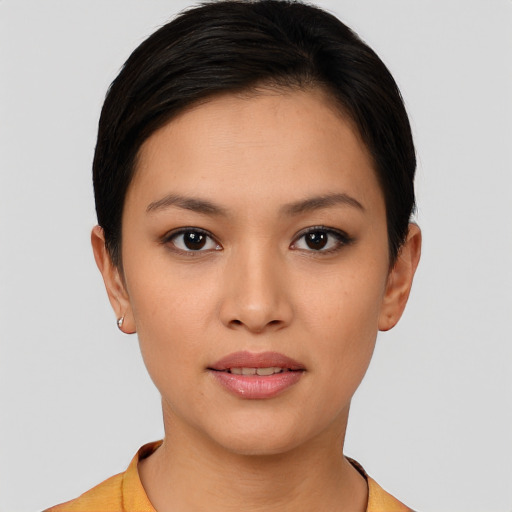 Joyful white young-adult female with short  black hair and brown eyes