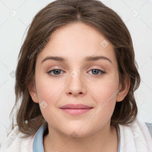 Joyful white child female with medium  brown hair and grey eyes