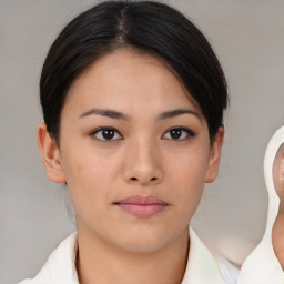 Neutral asian young-adult female with medium  brown hair and brown eyes