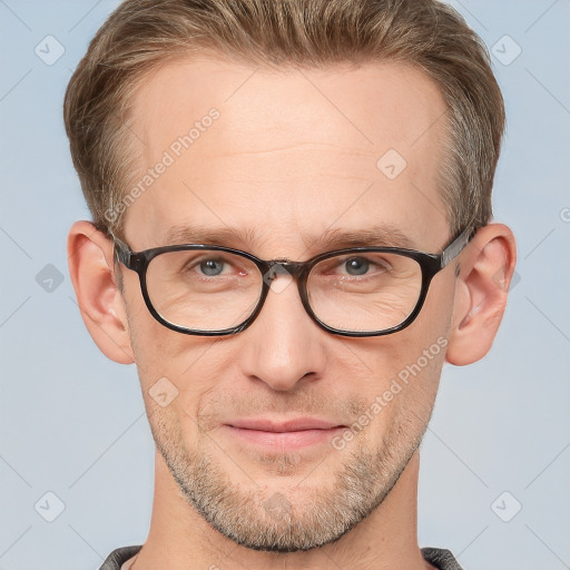 Joyful white adult male with short  brown hair and grey eyes