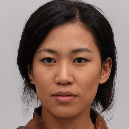 Neutral asian young-adult female with medium  black hair and brown eyes