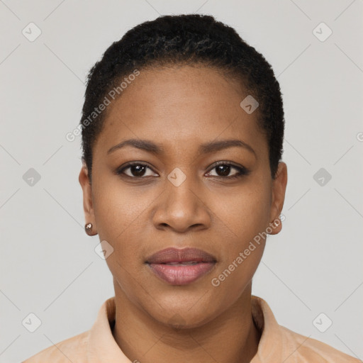 Joyful black young-adult female with short  black hair and brown eyes