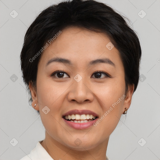 Joyful asian young-adult female with short  brown hair and brown eyes