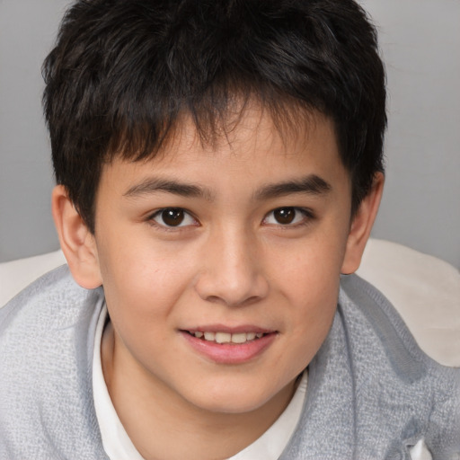 Joyful white child male with short  brown hair and brown eyes