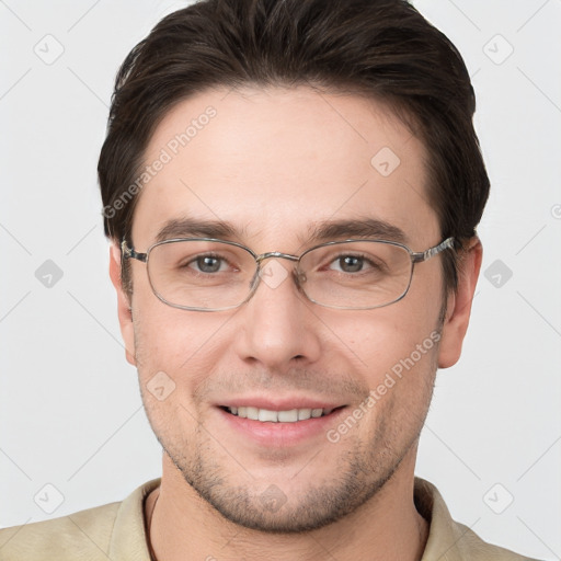 Joyful white young-adult male with short  brown hair and grey eyes