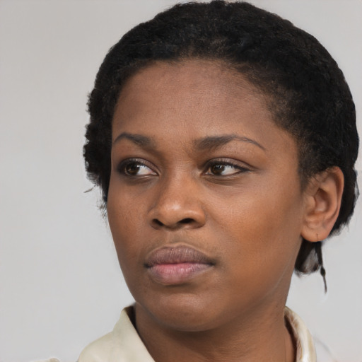 Neutral black young-adult female with short  black hair and brown eyes