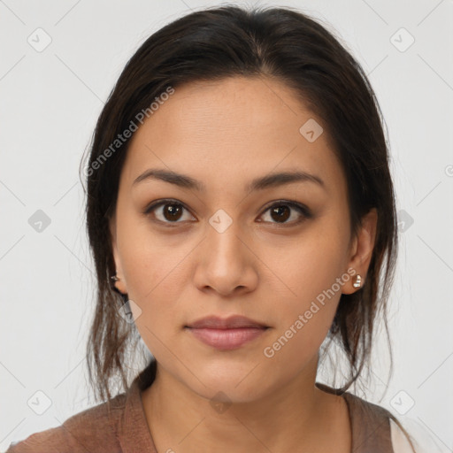 Joyful latino young-adult female with medium  brown hair and brown eyes