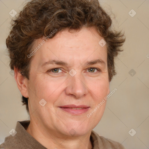 Joyful white adult female with medium  brown hair and blue eyes