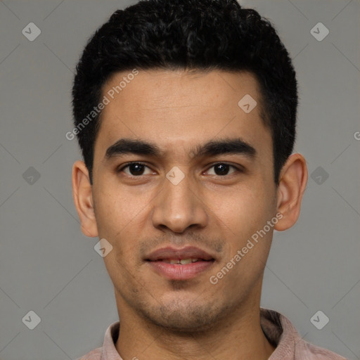 Joyful latino young-adult male with short  black hair and brown eyes