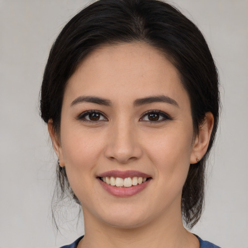 Joyful white young-adult female with medium  brown hair and brown eyes