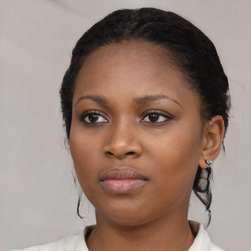Neutral black young-adult female with medium  black hair and brown eyes
