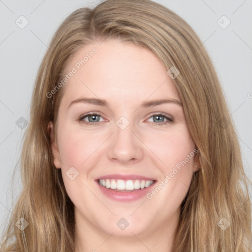 Joyful white young-adult female with long  brown hair and blue eyes