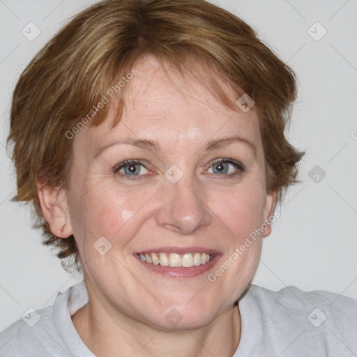 Joyful white adult female with medium  brown hair and blue eyes