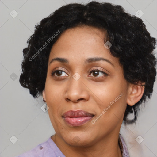 Joyful black adult female with medium  black hair and brown eyes