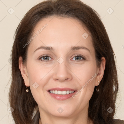 Joyful white young-adult female with long  brown hair and grey eyes