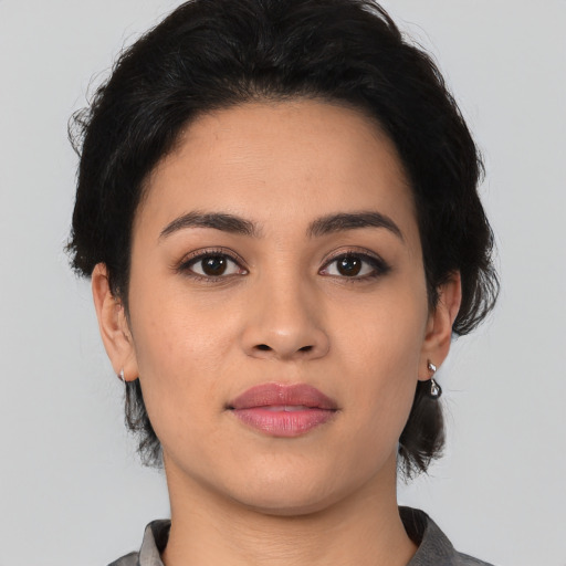 Joyful white young-adult female with medium  black hair and brown eyes