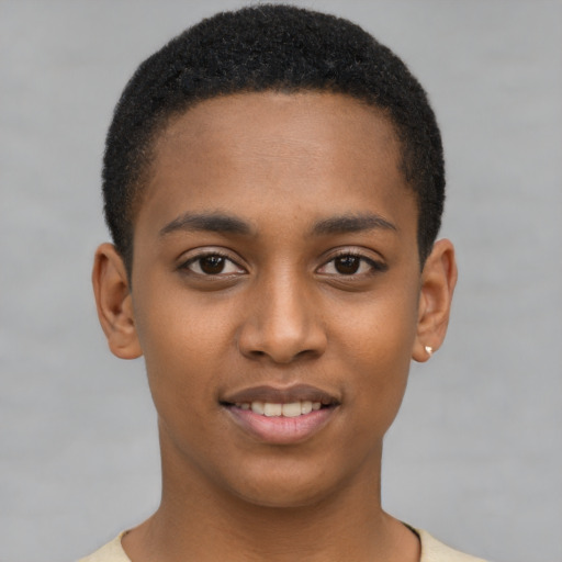 Joyful black young-adult male with short  brown hair and brown eyes