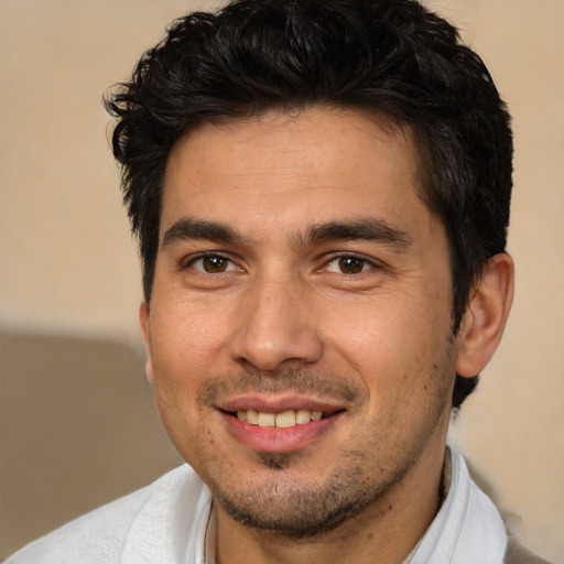 Joyful white adult male with short  brown hair and brown eyes