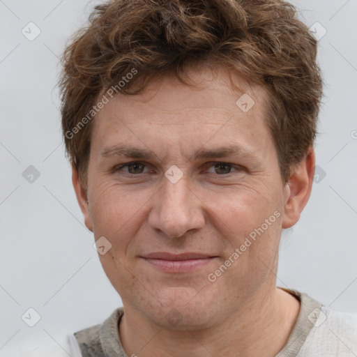 Joyful white adult male with short  brown hair and grey eyes