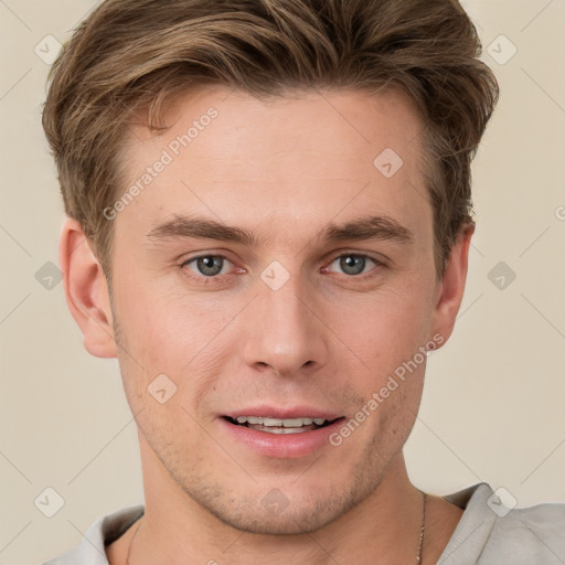 Joyful white young-adult male with short  brown hair and grey eyes