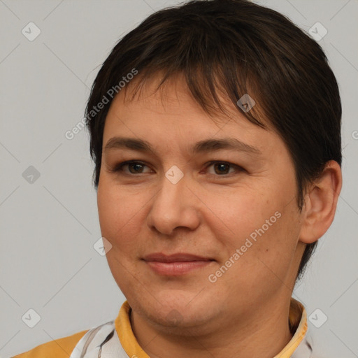 Joyful white adult female with short  brown hair and brown eyes