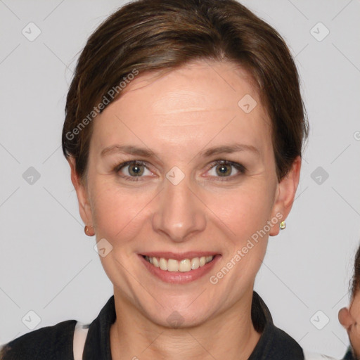 Joyful white adult female with short  brown hair and brown eyes