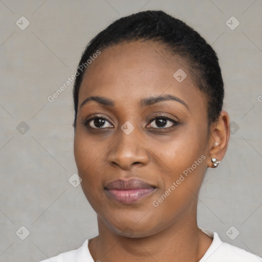 Joyful black young-adult female with short  black hair and brown eyes