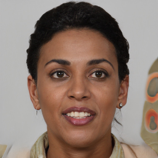 Joyful latino young-adult female with short  brown hair and brown eyes