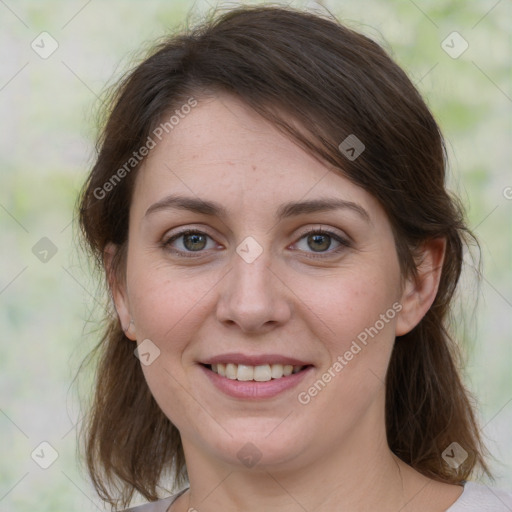 Joyful white young-adult female with medium  brown hair and green eyes