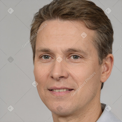 Joyful white adult male with short  brown hair and brown eyes