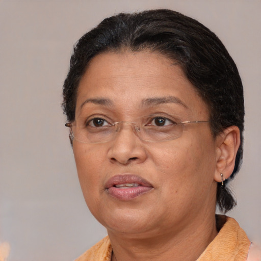 Joyful asian adult female with short  brown hair and brown eyes