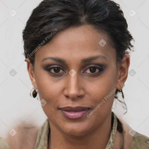 Joyful black young-adult female with short  brown hair and brown eyes