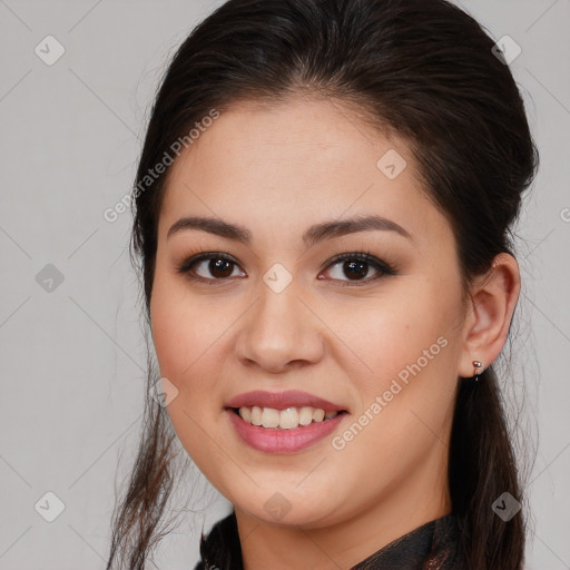 Joyful white young-adult female with long  brown hair and brown eyes