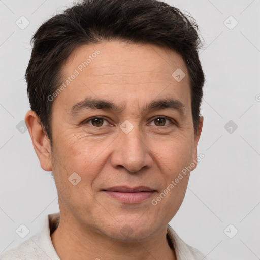 Joyful white adult male with short  brown hair and brown eyes