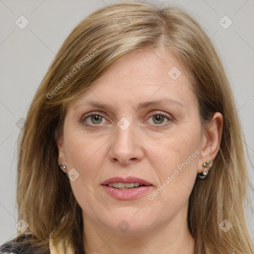 Joyful white adult female with medium  brown hair and brown eyes