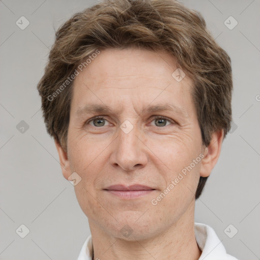 Joyful white adult male with short  brown hair and grey eyes