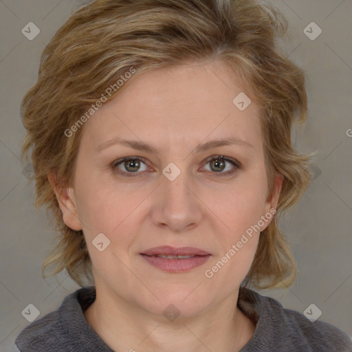 Joyful white adult female with medium  brown hair and blue eyes