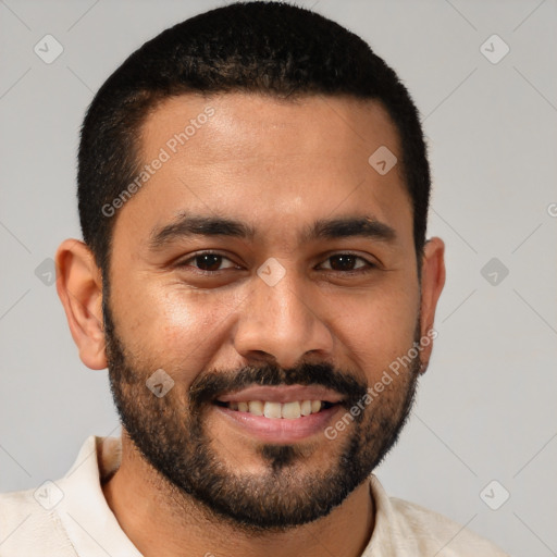 Joyful white young-adult male with short  black hair and brown eyes