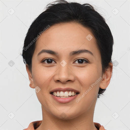 Joyful latino young-adult female with short  brown hair and brown eyes