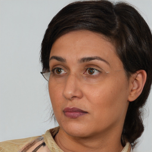 Neutral white adult female with medium  brown hair and brown eyes