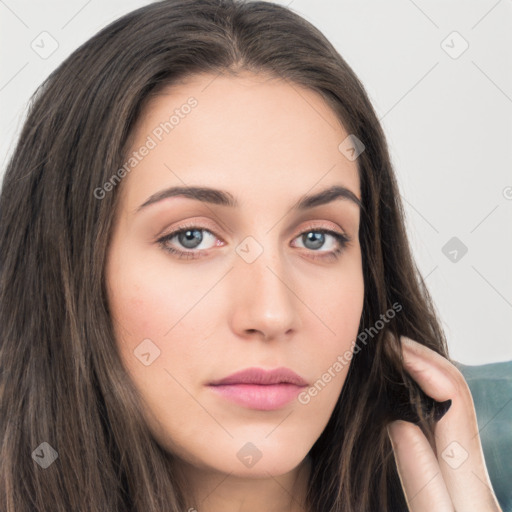 Neutral white young-adult female with long  brown hair and brown eyes