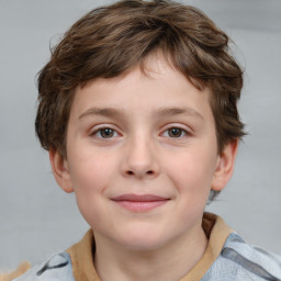 Joyful white child male with short  brown hair and brown eyes