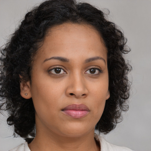 Neutral latino young-adult female with medium  brown hair and brown eyes