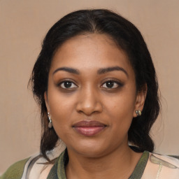 Joyful black young-adult female with medium  brown hair and brown eyes