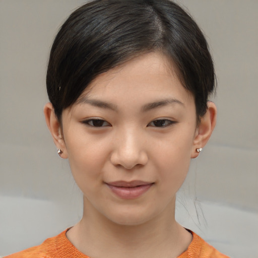 Joyful white child female with short  brown hair and brown eyes