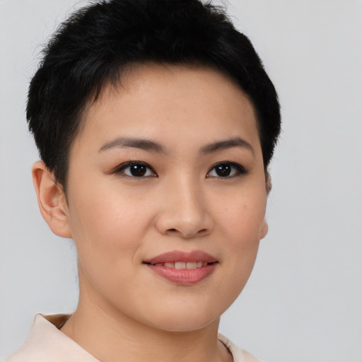 Joyful asian young-adult female with short  brown hair and brown eyes